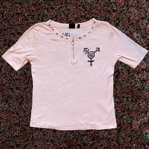 Gothic transgender symbol linocut print on cute light pink Rafaella top